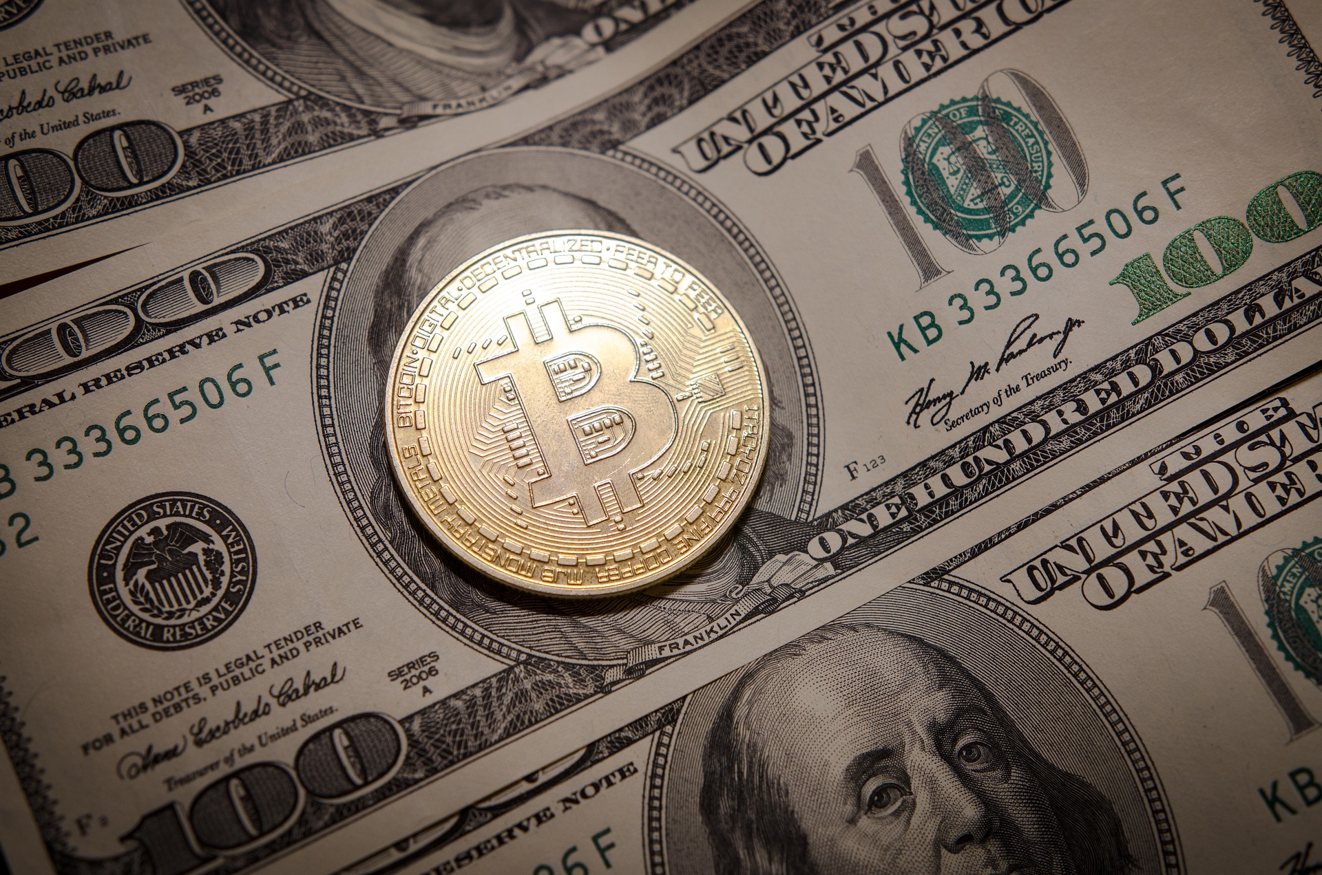 Bitcoin and dollar bank notes