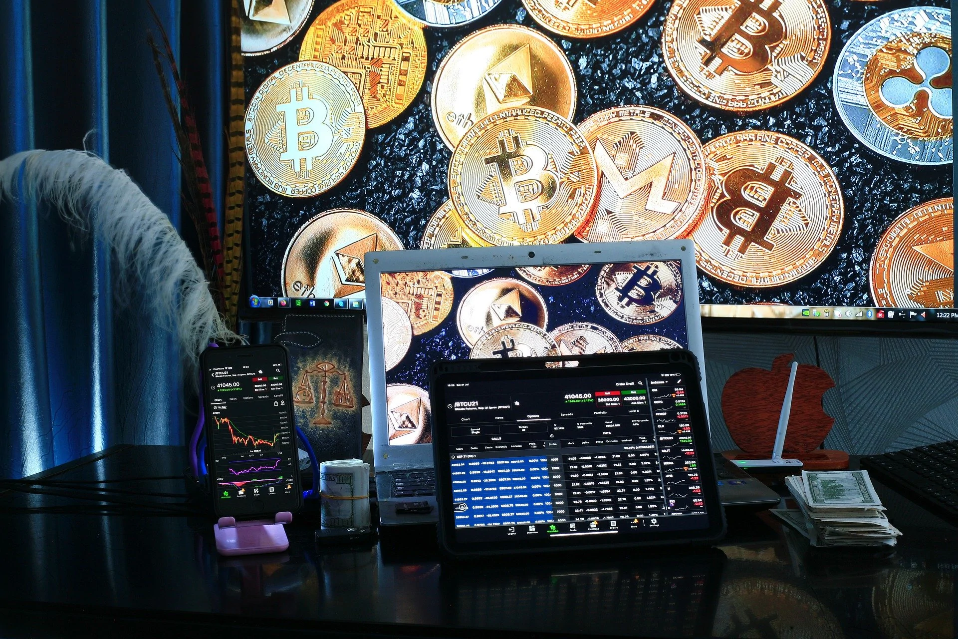 Cryptocurrency trading via laptop and smartphone